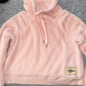 Light pink fuzzy turtle neck sweater with thumb holes